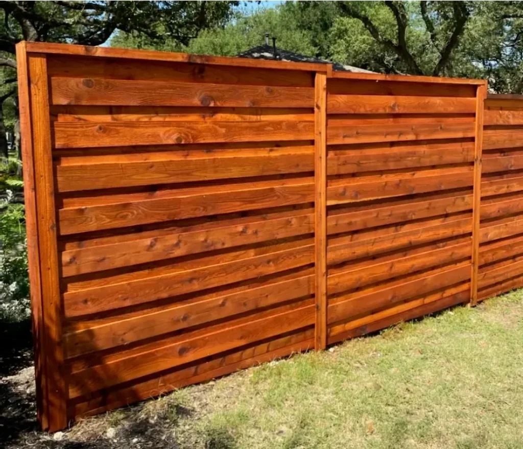 Horizontal cedar fence in the backyard of a Leander home.